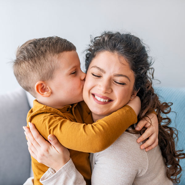 woman and young son smiling