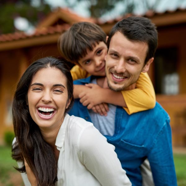 family of three laughing